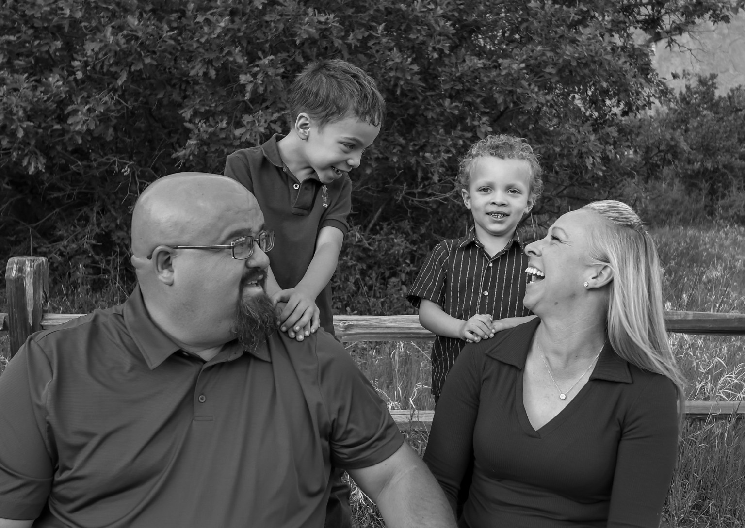 A family sharing a laugh outdoors