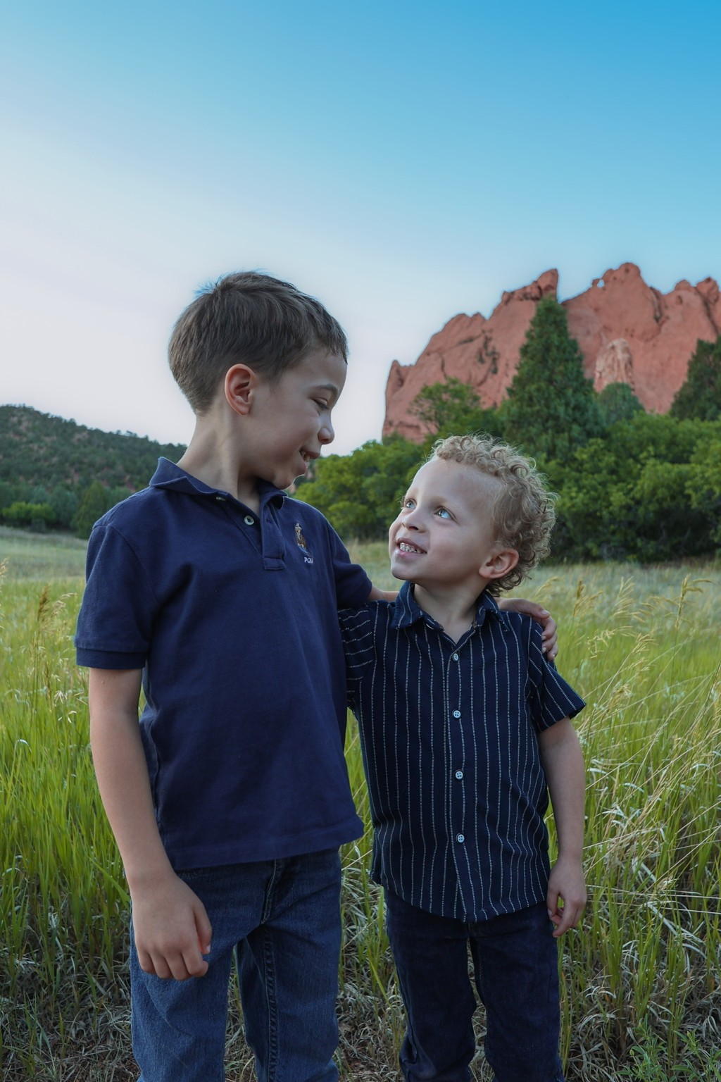 Two boys smiling together at Garden of the Gods