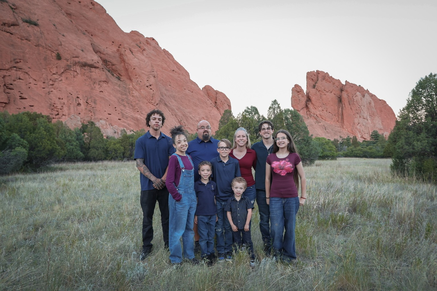 A family gathered beneath the red rock formations