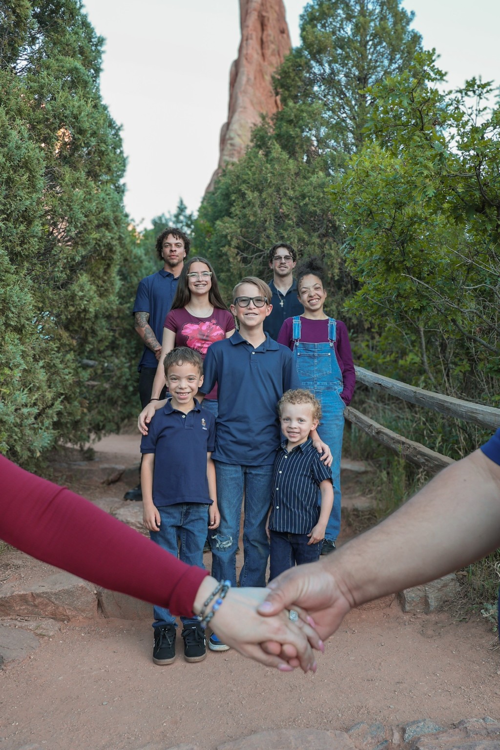 A family framed by joined hands