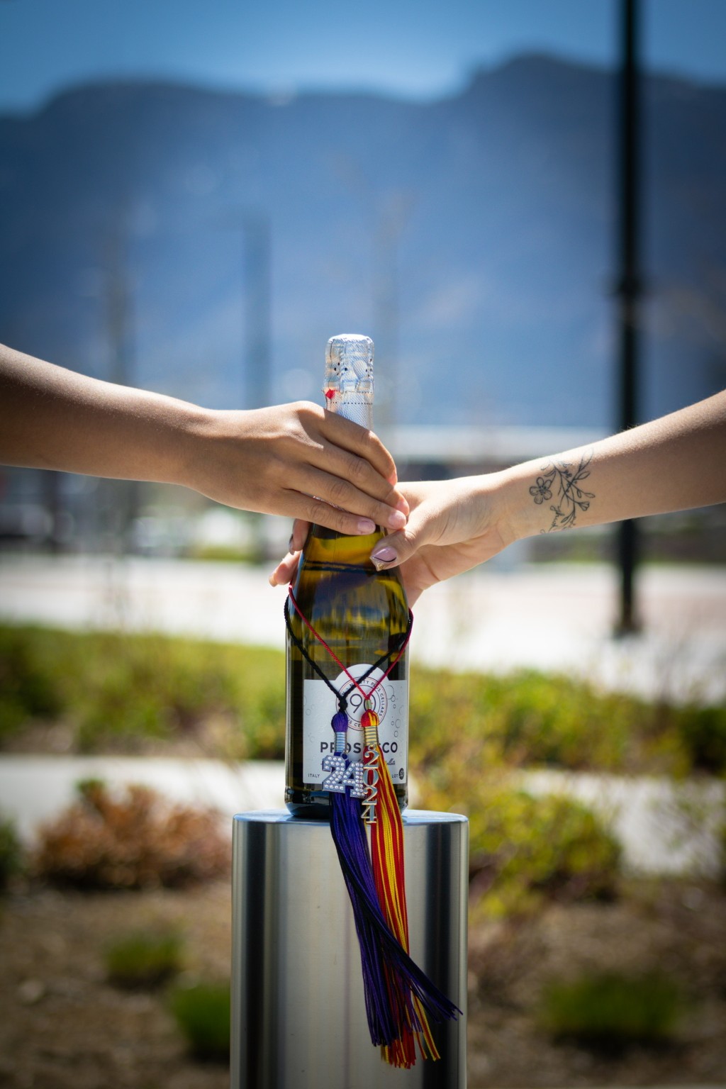 A graduation celebration with a decorated bottle