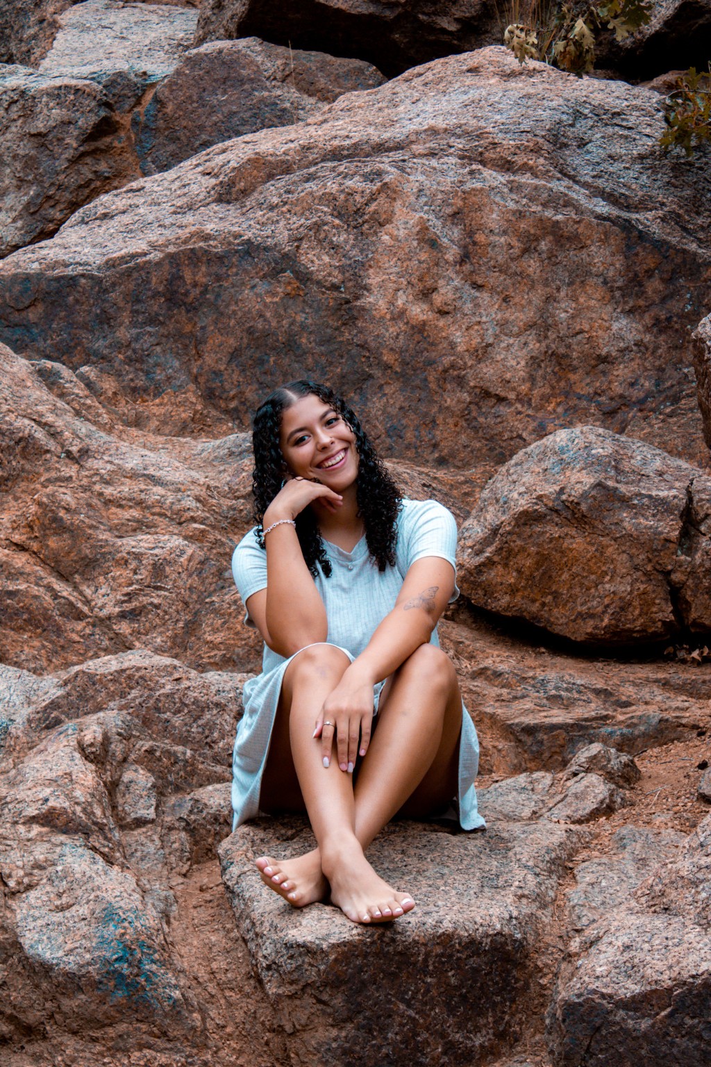 A portrait seated among Colorado red rocks
